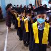 Kindergarten students wait for their name to be called before taking their place in the graduation ceremony...the first of their educational career.  